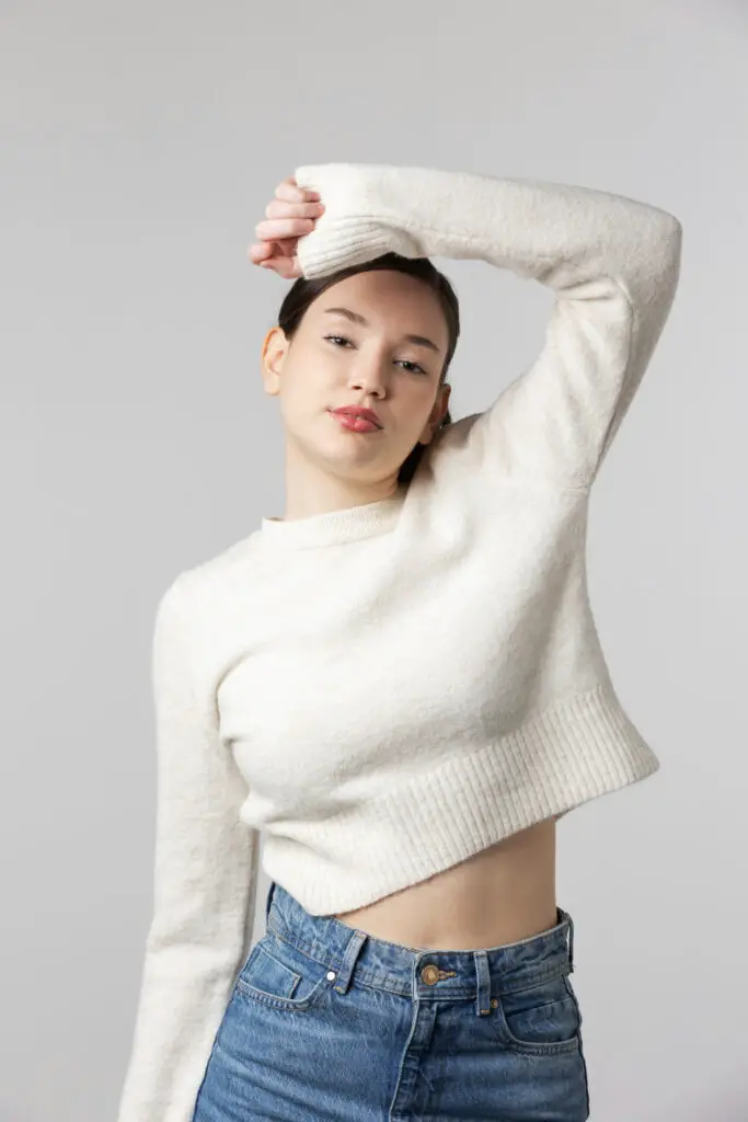 girl wearing white t shirt posing studio